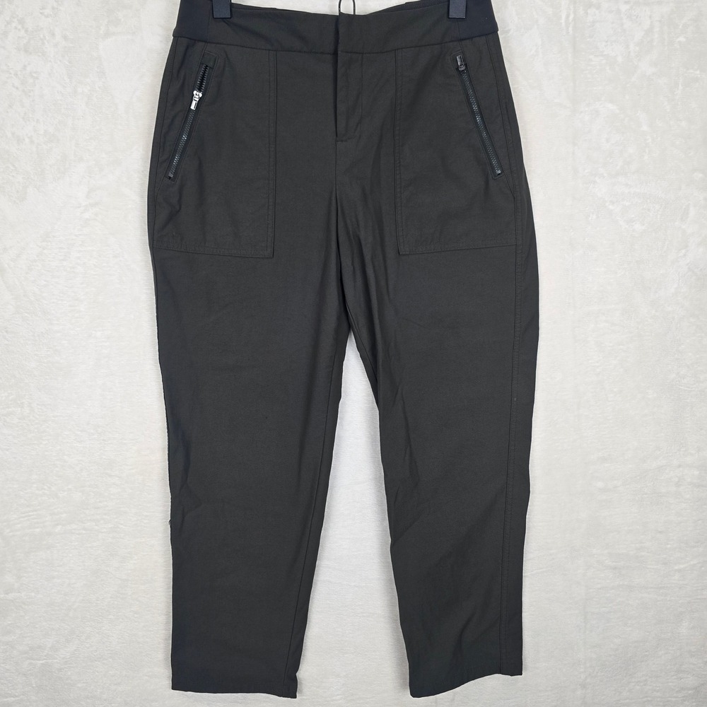 Athleta Wander Hybrid Straight Leg Pants 6P Dark Olive Green Zip Pocket Travel